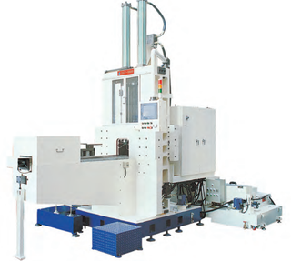 Large white Dong Il DCF-1000E counter-flow rolling machine on a blue base with a loading arm and hydraulic unit
