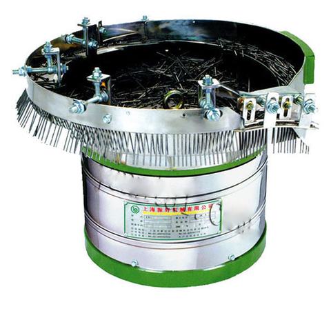 Chen Tai LY series stainless steel vibratory bowl feeder with green base, loaded with screws