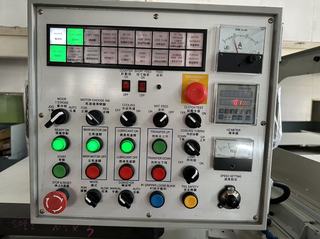 Operator control panel of a Chun Zu CBF series bolt former with indicator lights, selector switches, gauges and an emergency stop